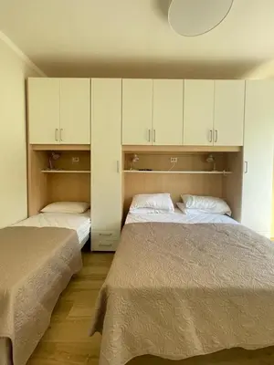 Letto o letti in una camera di VILLA EMMA -WALTERIGATO Apartments SOLO PER FAMIGLIE
