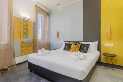 Letto o letti in una camera di Tadomo - Corte del Cafetier