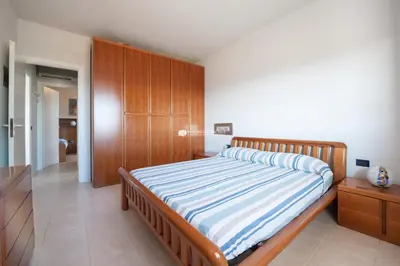 Letto o letti in una camera di Residence El Palmar Immobiliare Pacella