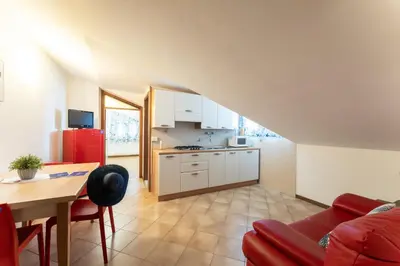 Cucina o angolo cottura di Quadrilocale e Mansarde Bafile241 - Adria Holiday Jesolo - FAMILY APARTMENTS
