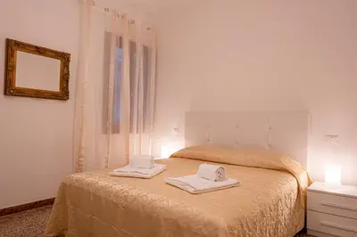 Letto o letti in una camera di The Heart of San Marco - WiFi
