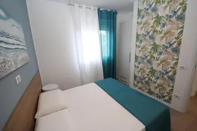 Letto o letti in una camera di Residence Verdena appartamento 02