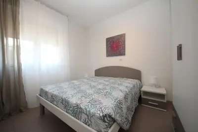 Letto o letti in una camera di Residence Verdena appartamento 02