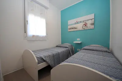 Letto o letti in una camera di Residence Verdena appartamento 03