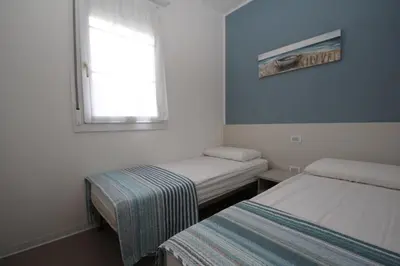 Letto o letti in una camera di Residence Verdena appartamento 03
