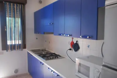 Cucina o angolo cottura di Acquasmeralda appartamento 01