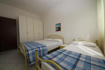 Letto o letti in una camera di Acquasmeralda appartamento 03