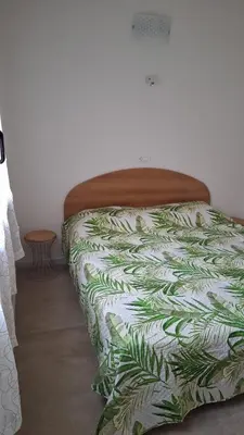 Letto o letti in una camera di Villa Gloria appartamento D01