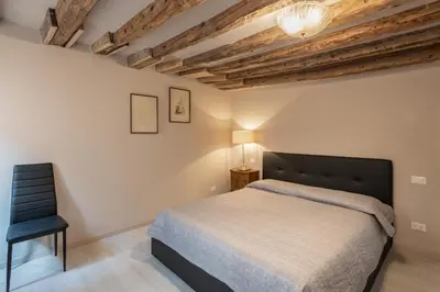 Letto o letti in una camera di ANDREA Venice FLAT 3rd Floor