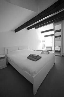 Letto o letti in una camera di Casa Mosaico