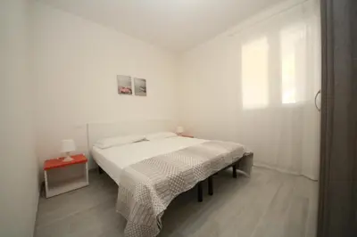Letto o letti in una camera di Villa Manu appartamento 02