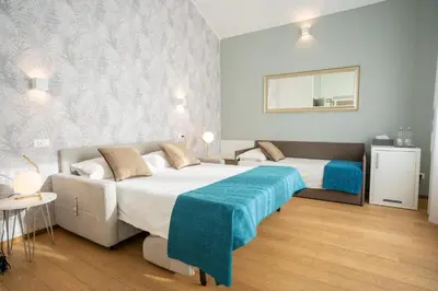 Letto o letti in una camera di B&B Villa Rosa