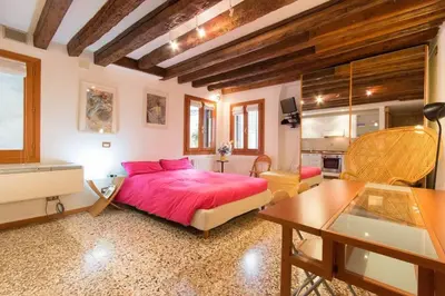 Letto o letti in una camera di Appartamenti Cà d'Oro