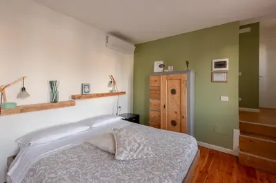 Letto o letti in una camera di BACARìA DA DANTE Rooms