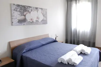 Letto o letti in una camera di Locazione Turistica Elite Parco Brentelle bed & breakfast - Chiesanuova 135 e 167