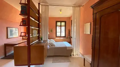 Letto o letti in una camera di CA' ROMANTICA - BIG APPARTMENT at ACCADEMIA