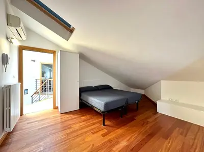 Letto o letti in una camera di Villa Daniela con piscina - Carraro Immobiliare - Family Apartments