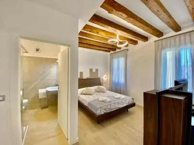 Letto o letti in una camera di Suite House 4343 apartments