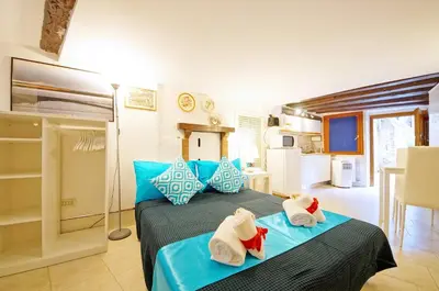 Letto o letti in una camera di Corte Rota Terrace San Marco