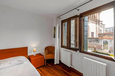 Letto o letti in una camera di Residenza Ca' Giacomo