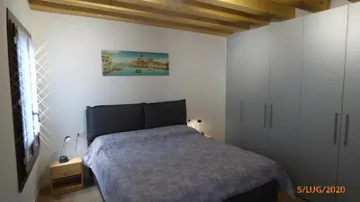 Letto o letti in una camera di CASA MODERNA A DUE PASSI DA RIALTO