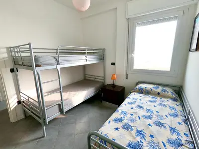 Letto o letti in una camera di Terrazza Piramide- Carraro Immobiliare - Family Apartments