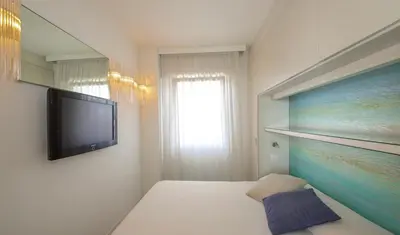 TV o dispositivi per l'intrattenimento presso Dominique - Carraro Immobiliare - Family Apartments