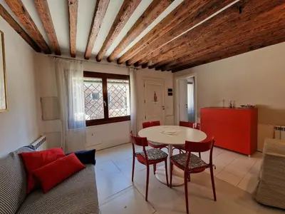 Area soggiorno di Veneziacentopercento Ca' Riello Apartment