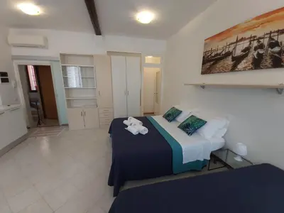 Letto o letti in una camera di Veneziacentopercento Corderie Apartment