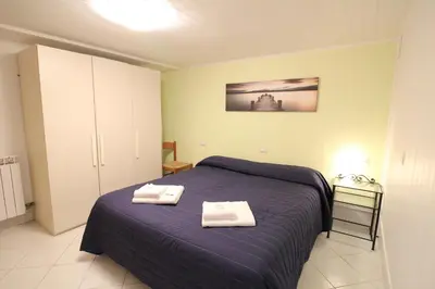 Letto o letti in una camera di Veneziacentopercento Picenin Apartment