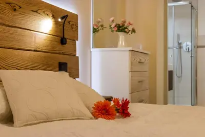Letto o letti in una camera di Veneziacentopercento Arco Apartment