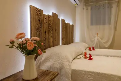 Letto o letti in una camera di Veneziacentopercento Arco Apartment