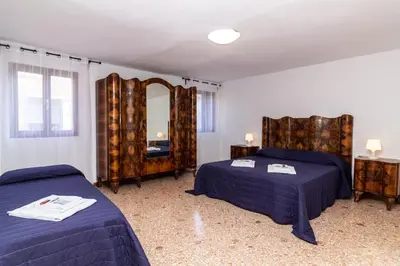 Letto o letti in una camera di Veneziacentopercento Ole Apartment
