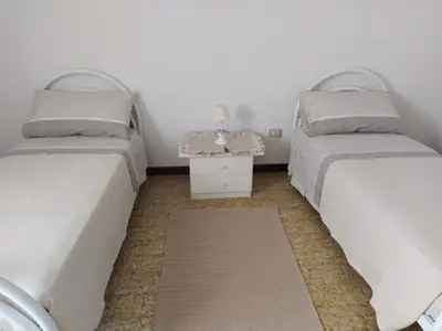 Letto o letti in una camera di Casa via degli Ulivi 13