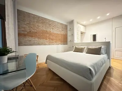 Letto o letti in una camera di San Marco Baretteri Design Suite 2 min from St Mark