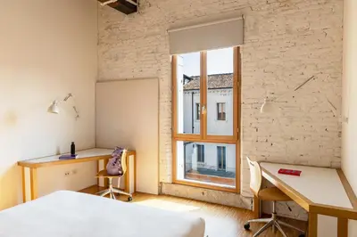 Letto o letti in una camera di Combo Venezia