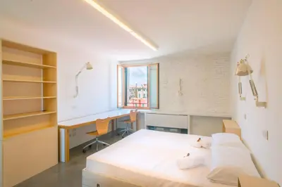 Letto o letti in una camera di Combo Venezia