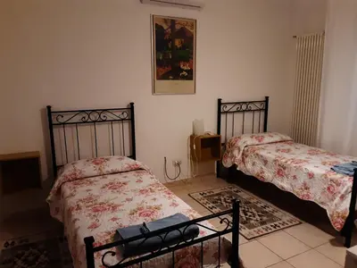 Letto o letti in una camera di Locazione Menini - Appartamento zona stazione