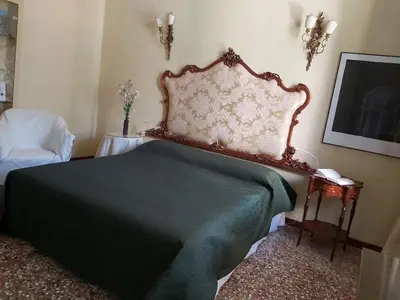 Letto o letti in una camera di A PRIVATE TERRACE IN THE HEART OF VENICE