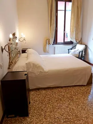Letto o letti in una camera di A PRIVATE TERRACE IN THE HEART OF VENICE