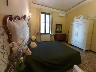 Letto o letti in una camera di A PRIVATE TERRACE IN THE HEART OF VENICE