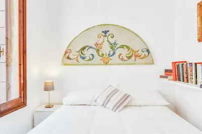 Letto o letti in una camera di GuestHost - Ca Lu Vintage Flat con Vista su San Marco!