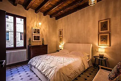Letto o letti in una camera di Cà Fenice Design