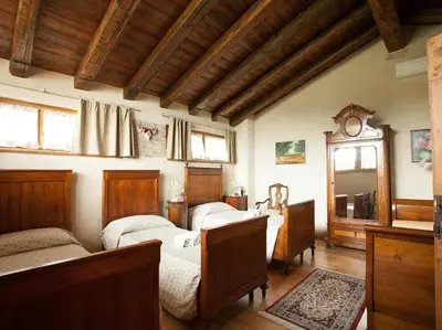 Letto o letti in una camera di B&B Asolo Casapagnano