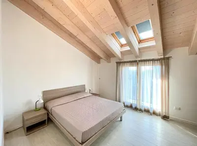Letto o letti in una camera di Residence Treporti - Carraro Immobiliare - Family Apartments