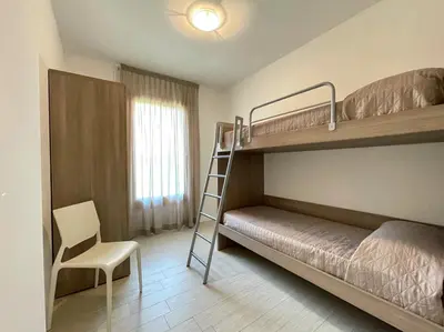 Letto o letti in una camera di Residence Treporti - Carraro Immobiliare - Family Apartments