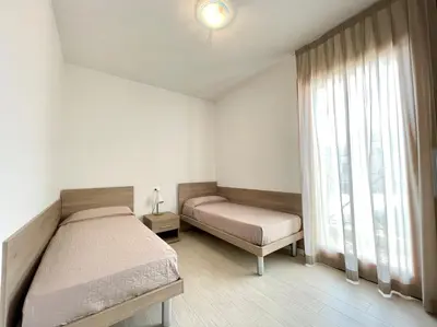 Letto o letti in una camera di Residence Treporti - Carraro Immobiliare - Family Apartments