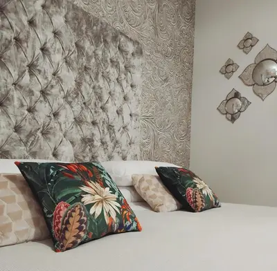 Letto o letti in una camera di B&B Cà del Poeta