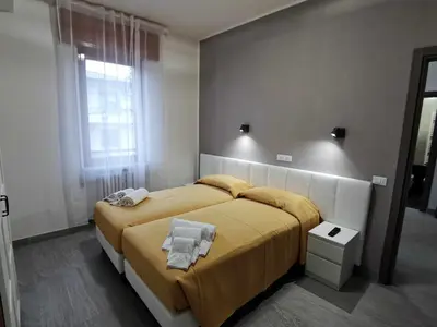 Letto o letti in una camera di Casa Belfiore Vicenza Via Medici 17