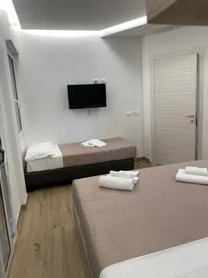 Letto o letti in una camera di Hotel Neps